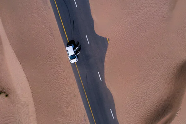 Aerial View of White Car on Dubai Road