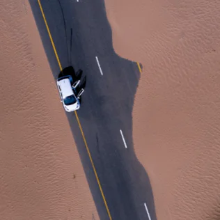 Aerial View of White Car on Dubai Road
