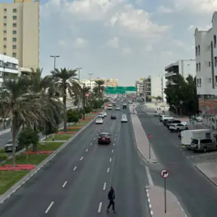 Busy Street in Dubai with High-Rise Buildings