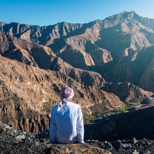 Man sitting on Jabal Jais UAE