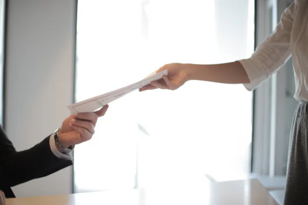 A women passing her documents