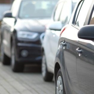 Cars parked in a parking bay on the side of the road