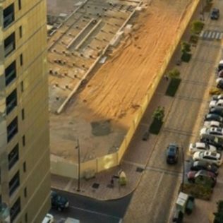 A captivating aerial view of Abu Dhabi's urban skyline and car parking at daylight.