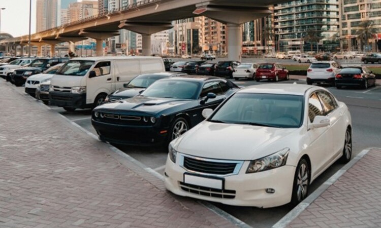 Cars Parked on Parking Lot Near High Rise Buildings in Dubai