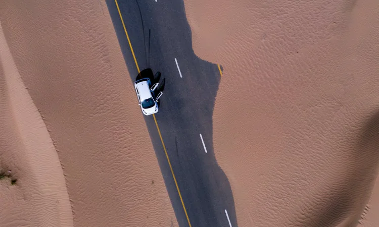  Aerial View of White Car on Dubai Road